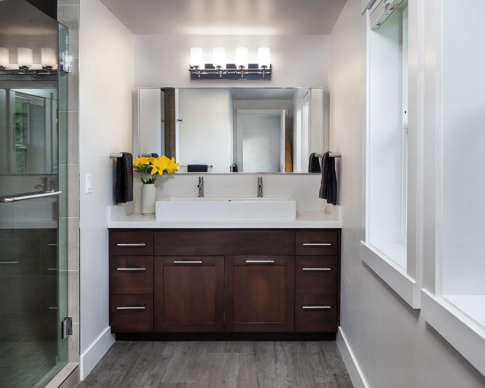 modern bathroom with wood vanity and double sinks