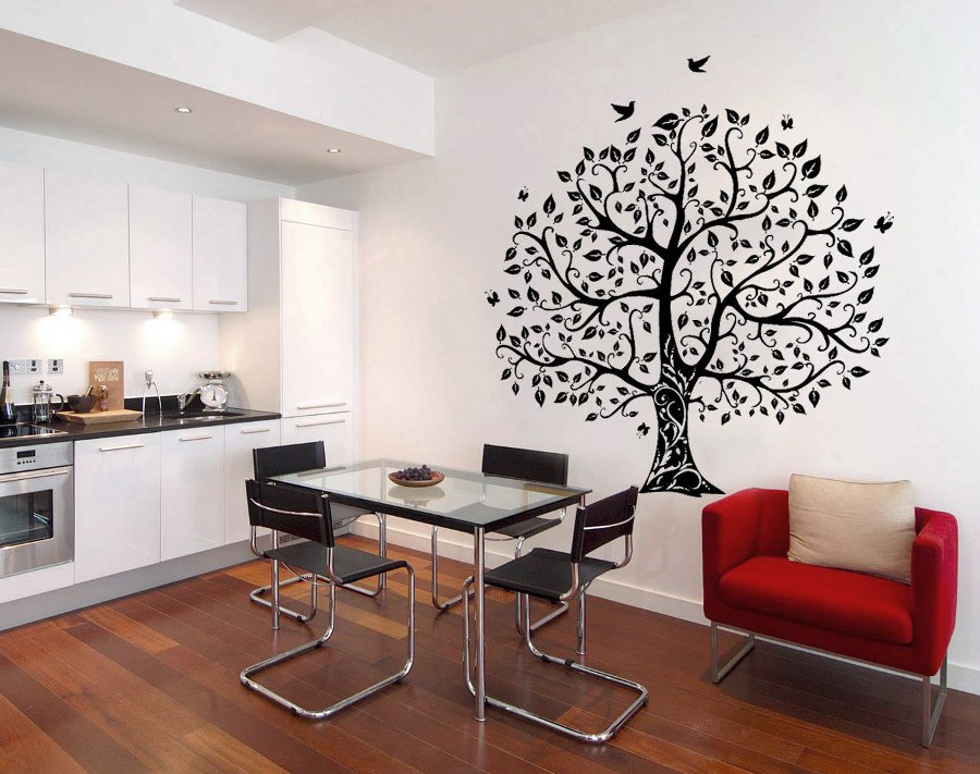 Dining room with black wall art of tree and birds